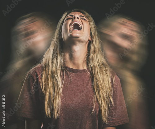 Horror, anxiety or bipolar woman shout in double exposure on a dark studio for psychology and mental health. Angry, schizophrenia or depressed frustrated girl with depression, fear and trauma mockup photo