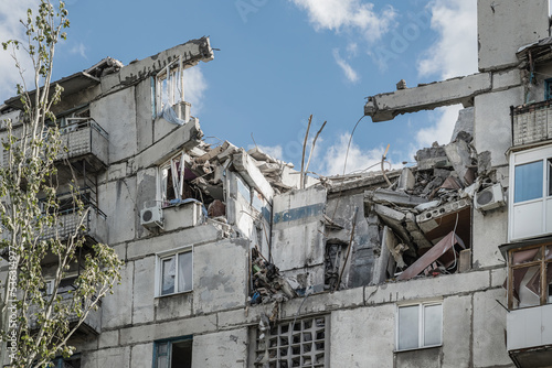 A fragment civilian building in Toretsk, Donetsk region, damaged by a Russian artillery shell (war concept)