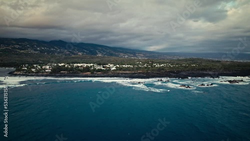 Wallpaper Mural Beautiful aerial drone shot of deep blue sea and coastal area of reunion island with waves crashing at rocks while sunset Torontodigital.ca