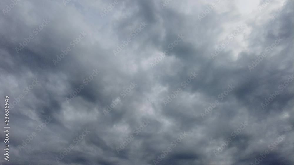 A View Of Dusky Clouds In Moody Sky During Stormy Day. Low Angle A View Of Dusky Clouds In Moody Sky During Stormy Day. Low Angle
