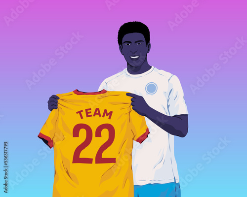 A player holding up a club team jersey