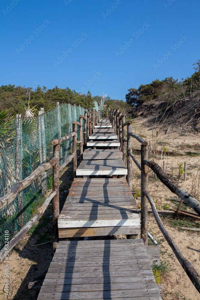wooden walkway on the beach of sabaudia at circeo latina