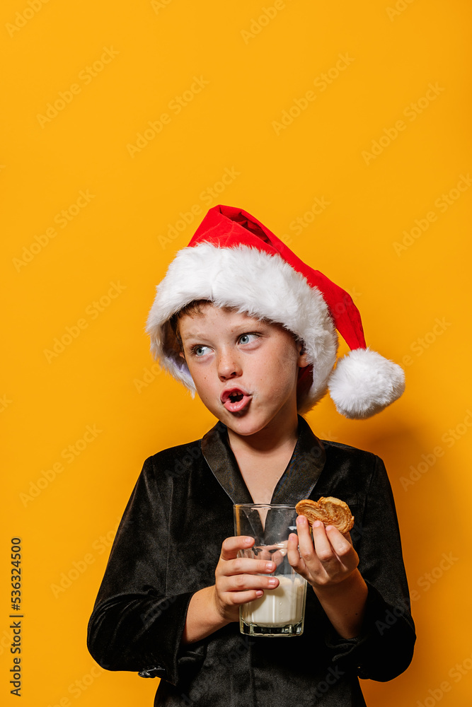 Boy with Christmas cookie and milk talking Boy with Christmas cookie and milk talking