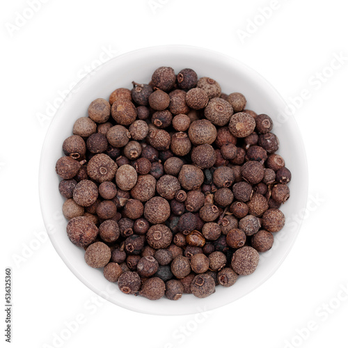 Black pepper in a white cup on a white background