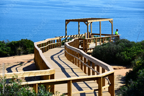Fotografie Lagos, Faro district, Algarve, Portugal, Europe - wooden walking trail on high c