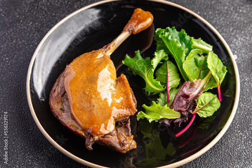 duck leg confit berry sauce second course healthy meal food snack diet on the table copy space food background rustic top view photo