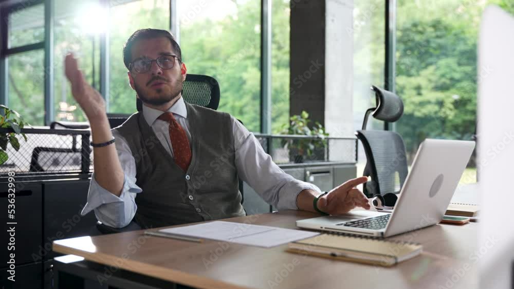 young business man talking to colleagues. Employee in the office talking to a colleague, explains the result of the project young business man talking to colleagues. Employee in the office talking to a colleague, explains the result of the project