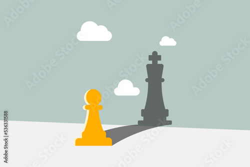 Chess pawn standing in a spotlight that make a shadow of king. trust yourself, self confident concept