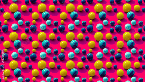 3D-image of blue and yellow marble balls on pink background