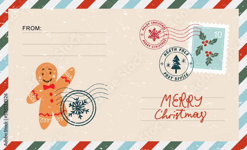 Christmas envelope with stamps, seals, gingerbread man and inscriptions Merry Christmas.