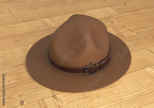 Scout hat, ranger hat, brown campaign hat on wooden background, 3d render