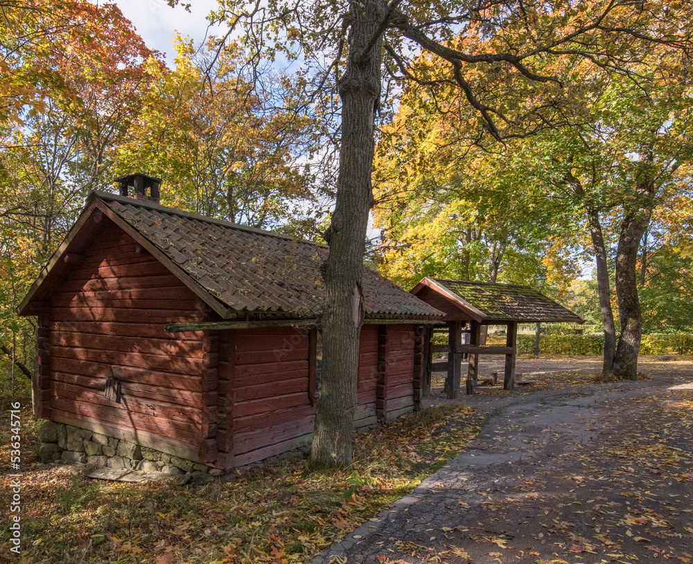 Old wood 1700s smithers house in a park a colorful sunny autumn day in Stockholm Old wood 1700s smithers house in a park a colorful sunny autumn day in Stockholm