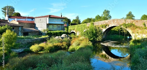 Puente medieval sobre el río Furelos en Melide, Galicia photo