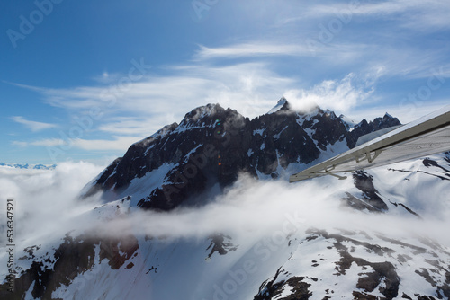 Airplane wing and mountain landscape photo