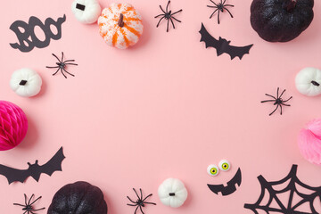 Happy Halloween holiday frame border. Glitter black pumpkin and party decorations on pink background. Top view, flat lay
