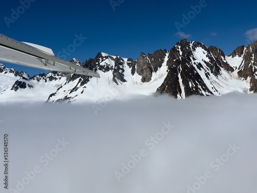 Airplane wing and mountain landscape photo