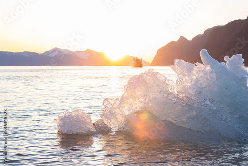Ice Berg floating in LeConte Bay backlight by the setting sun