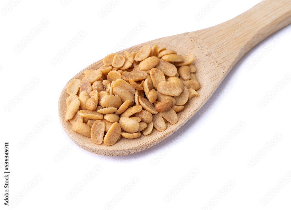 Fried soy beans snack in a spoon isolated over white background Fried soy beans snack in a spoon isolated over white background