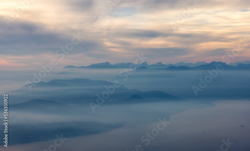 Canadian Mountain Landscape on the West Coast of Pacific Ocean. Dramatic Sunset and Hazy Smoky Sky. St. Mark's Summit near Vancouver, British Columbia, Canada. Nature Background