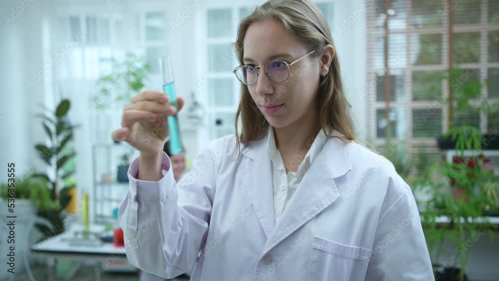 In the university science lab, researchers are analyzing studies on cannabis plants and performing chemical experiments on medicinal cannabis leaves. In the university science lab, researchers are analyzing studies on cannabis plants and performing chemical experiments on medicinal cannabis leaves.