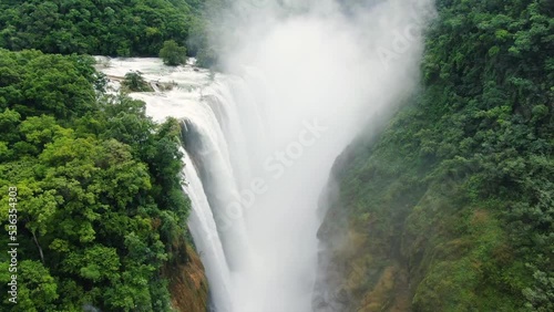 Wild Tamul waterfall landscape aerial drone.Awesome unspoiled forest cascade aerial vertical drone view. American Caribbean river cascade in the rainforest.
The tallest waterfall in the state. photo