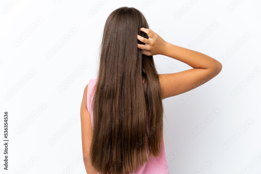 Little caucasian girl isolated on white background in back position and thinking Little caucasian girl isolated on white background in back position and thinking