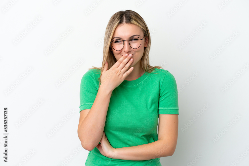 Young caucasian woman isolated on white background happy and smiling covering mouth with hand Young caucasian woman isolated on white background happy and smiling covering mouth with hand
