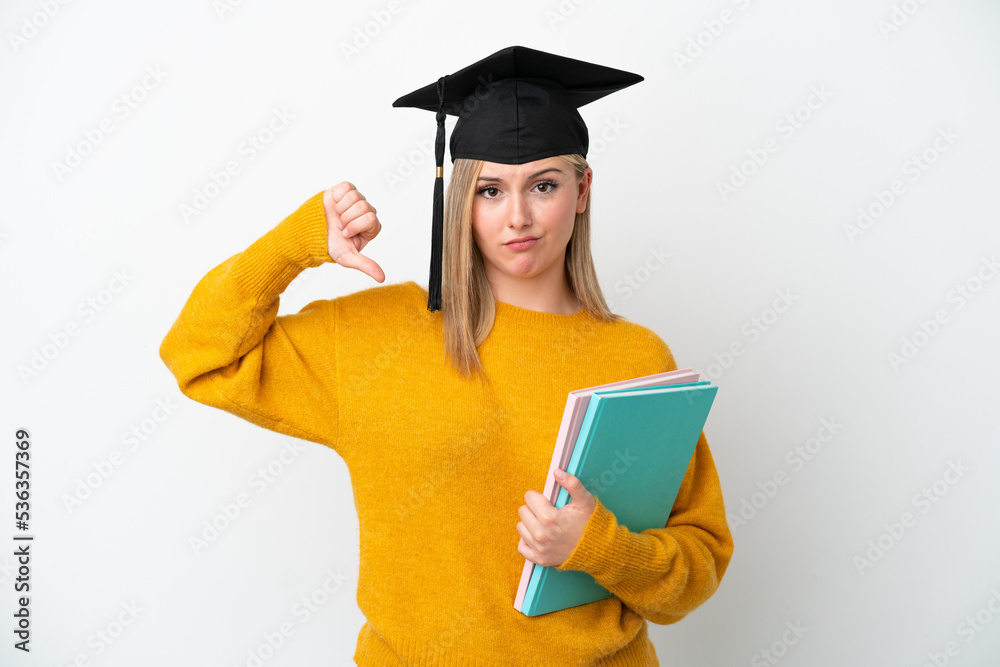 Young student caucasian woman isolated on white background showing thumb down with negative expression Young student caucasian woman isolated on white background showing thumb down with negative expression