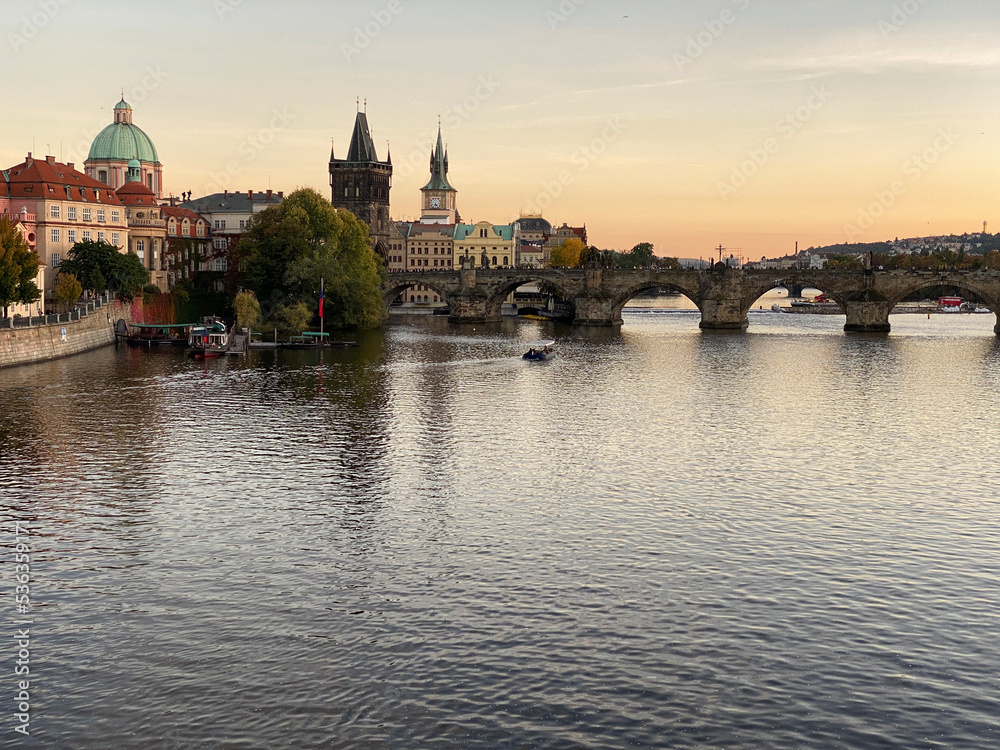 Sunset with a view on the Vltava River and Charles Bridge