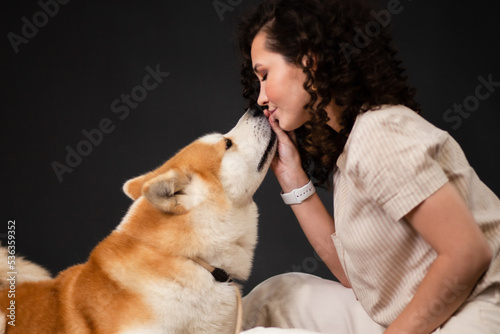 Akita inu Dog and young Woman, Japanese akita dog