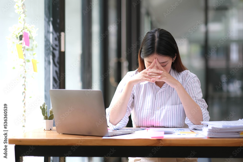 Businesswoman get stressed and headache while having a problem. Businesswoman get stressed and headache while having a problem.