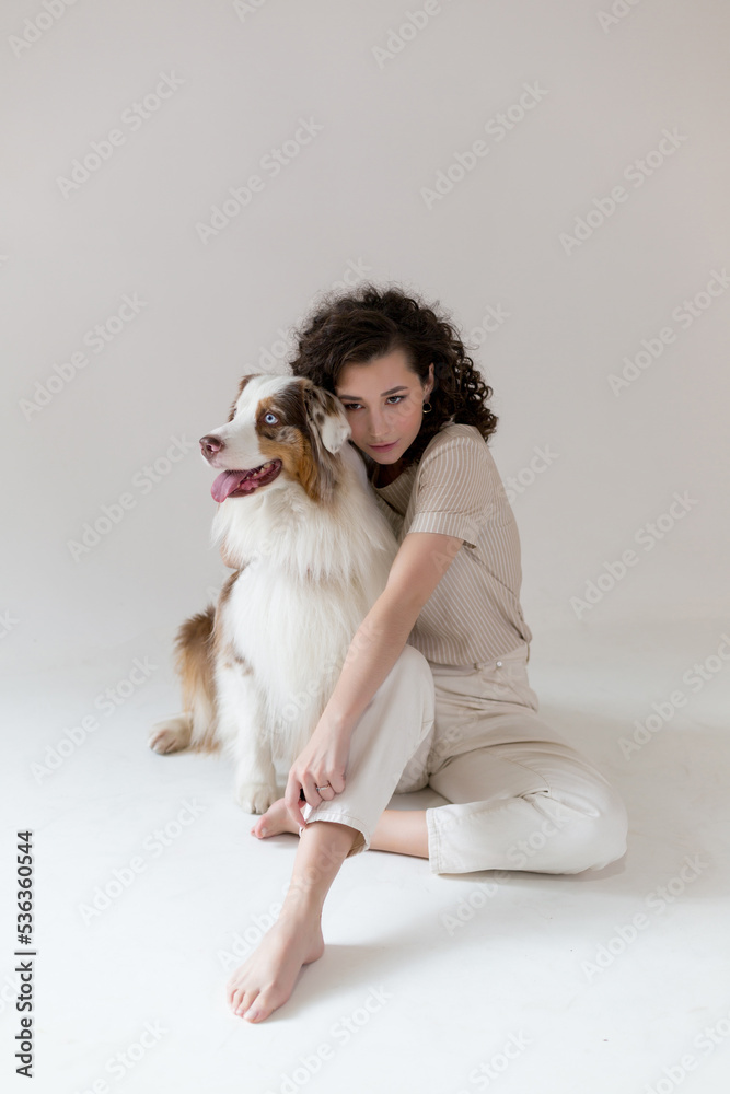 young Woman and Australian Shepherd Dog