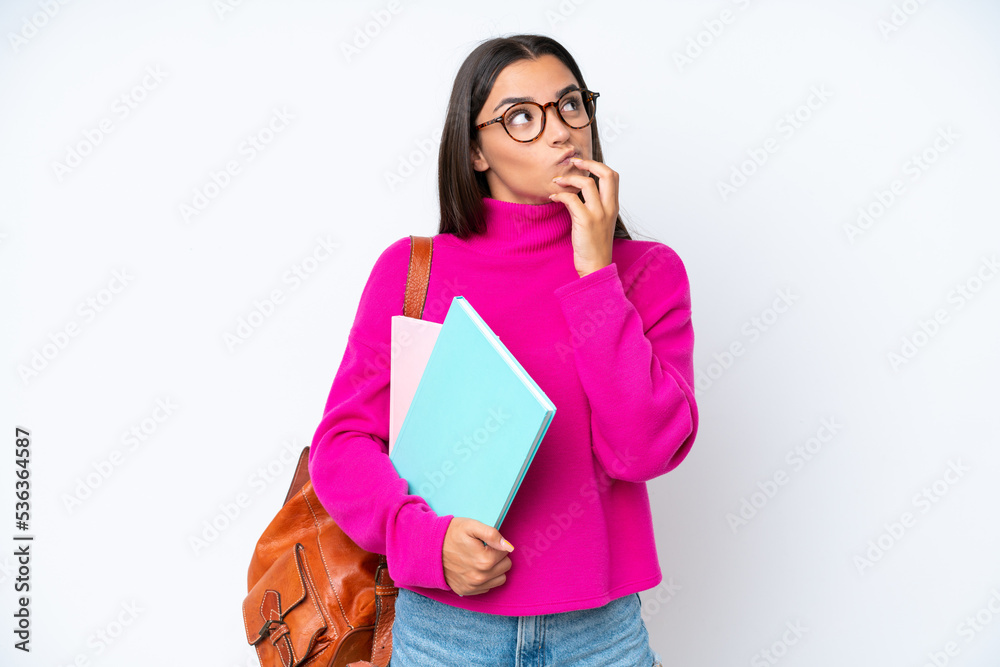 Young student woman isolated on white background having doubts Young student woman isolated on white background having doubts