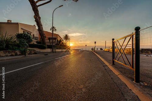 panorama of the asphalt road in the city at sunset