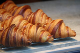 Close-up of fresh and beautiful croissants in a bakery showcase