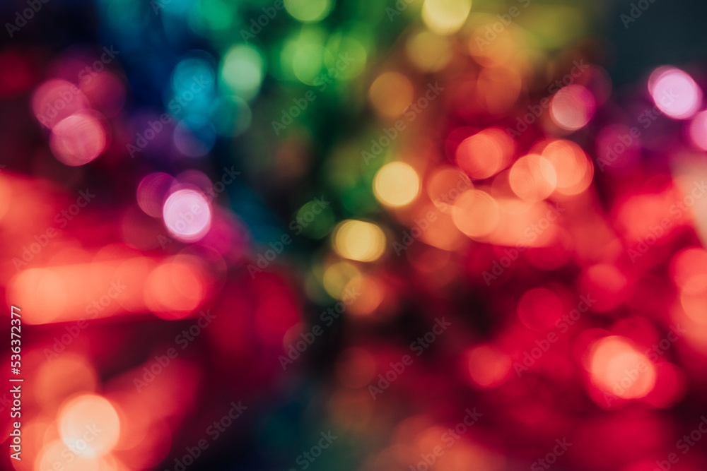 Fototapeta premium Blurred bokeh background for Christmas and New Year holiday. Abstract colorful wallpaper with defocused lights. Copy space