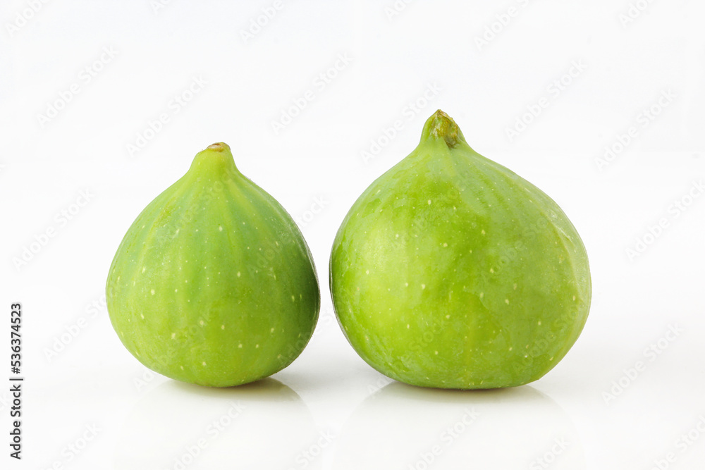 Two green figs isolated on white background Two green figs isolated on white background