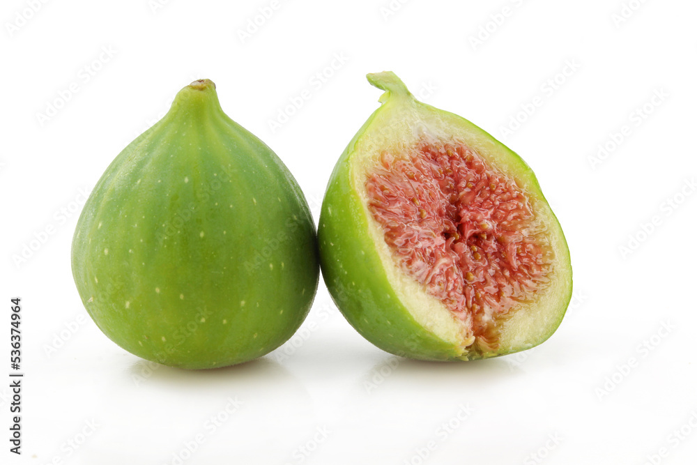 One whole green and sliced fig isolated on white background