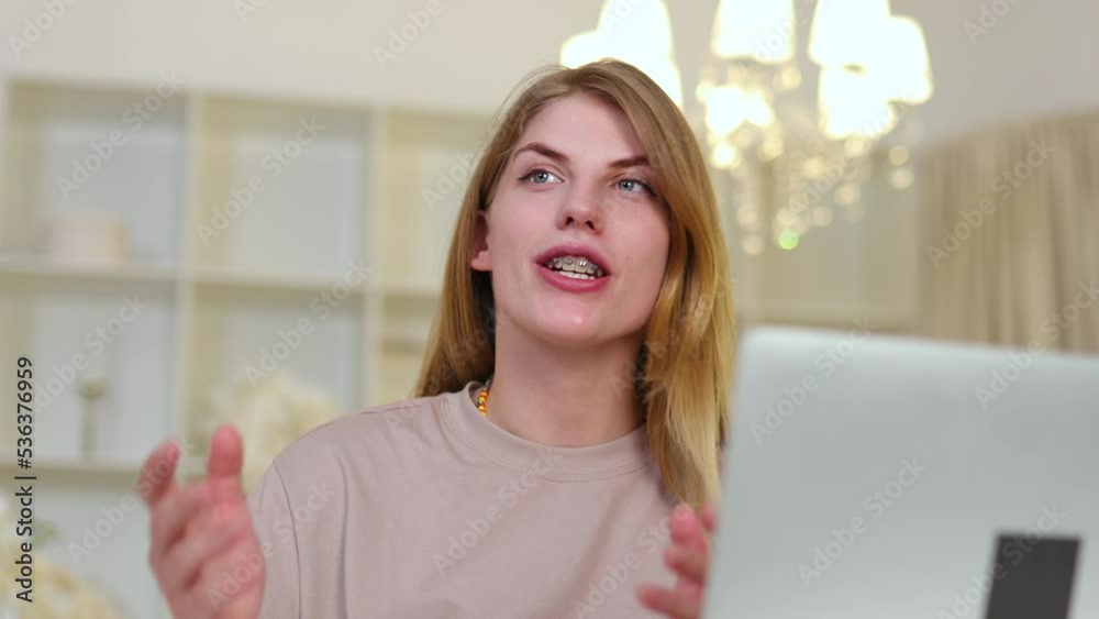 Portrait of Young Woman Talking On Camera. Cute Girl With Braces Close Up Portrait of Young Woman Talking On Camera. Cute Girl With Braces Close Up