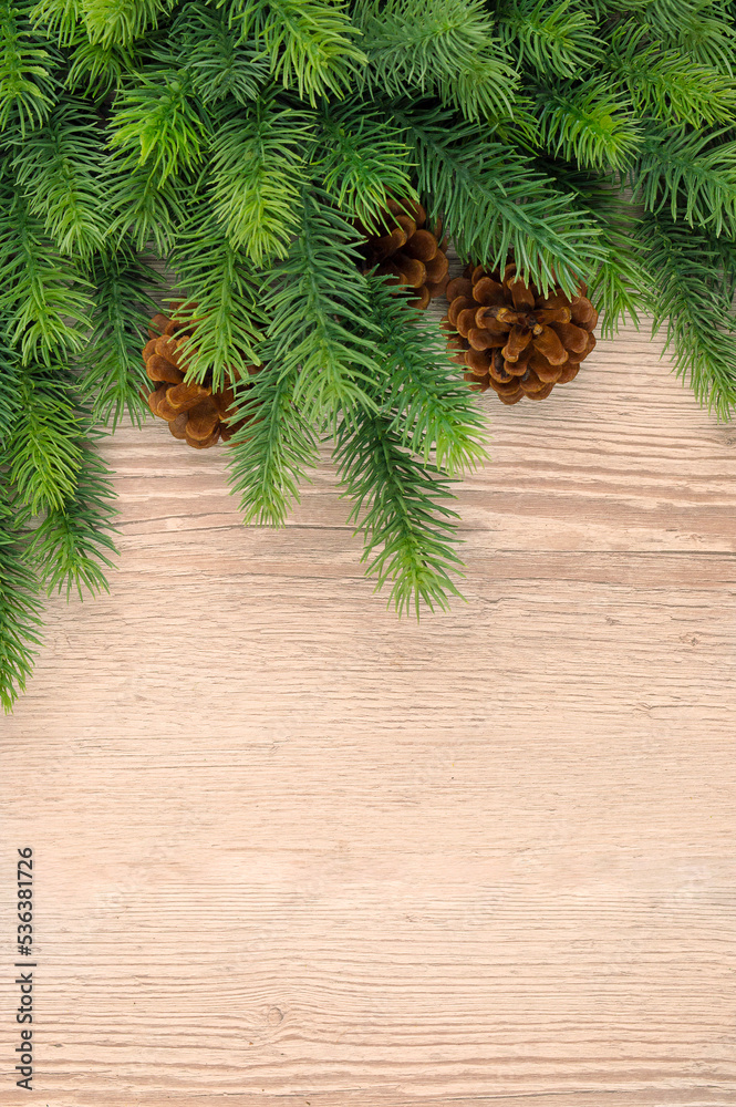 Christmas wooden background with fir tree.Light brown wooden background. Christmas decor, garland with Rustic Background Christmas wooden background with fir tree.Light brown wooden background. Christmas decor, garland with Rustic Background
