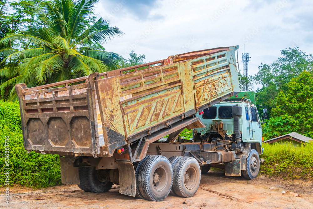 Obraz premium Old dirty trucks dump truck on construction site Phuket Thailand.