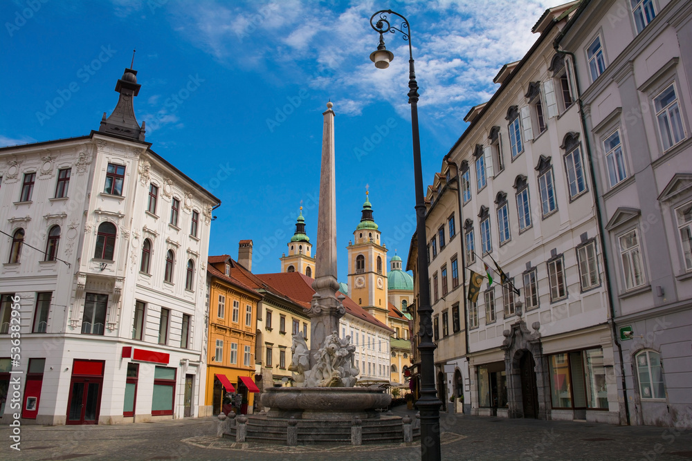 Robba Fountain in Town Square or Mestni Trg in central Ljubljana. Called Robbov Vodnjak in Slovenian, it is also known as the Fountain of the Three Carniolan Rivers. Ljubljana Cathedral is in the back