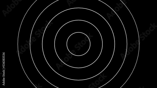 Concentric white rings moving on the black background. Radio waves, radar or sonar animation. photo