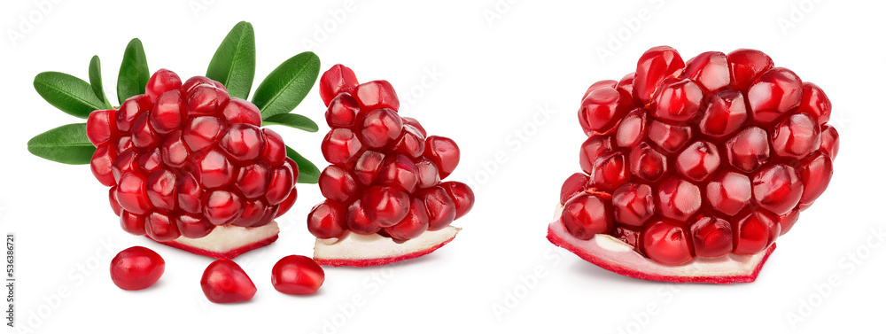 Pomegranate pieces isolated on white background with full depth of field. Pomegranate pieces isolated on white background with full depth of field.