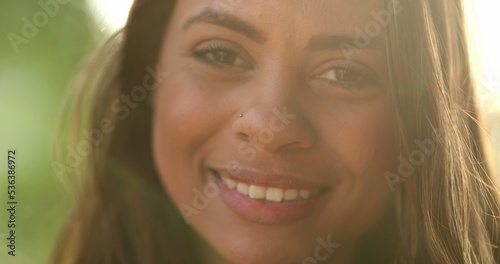 Latina black girl smiling portrait in sunlight outside