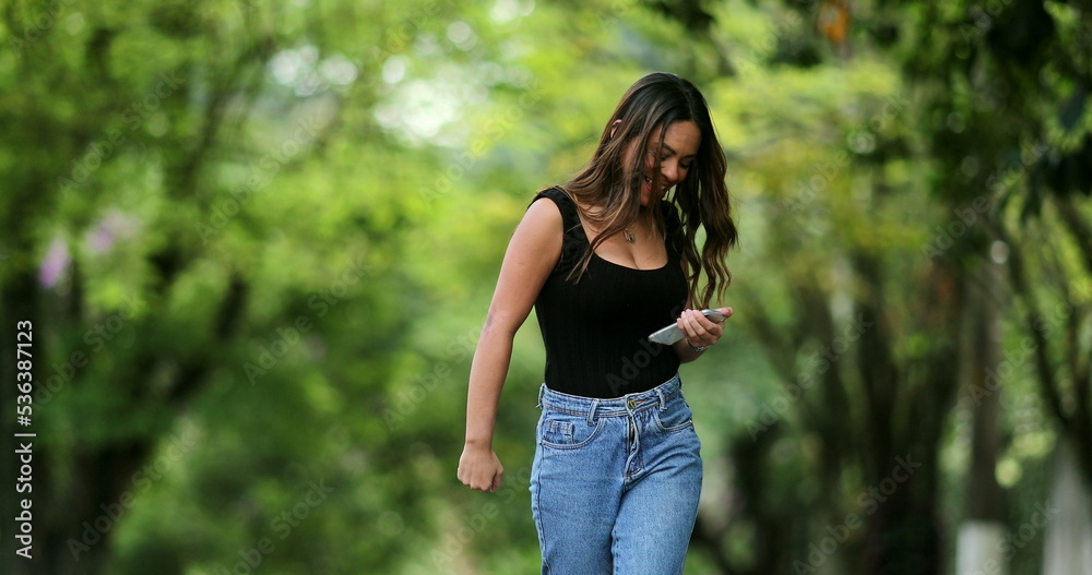Joyful woman jumping with joy feeling ecstatic celebration