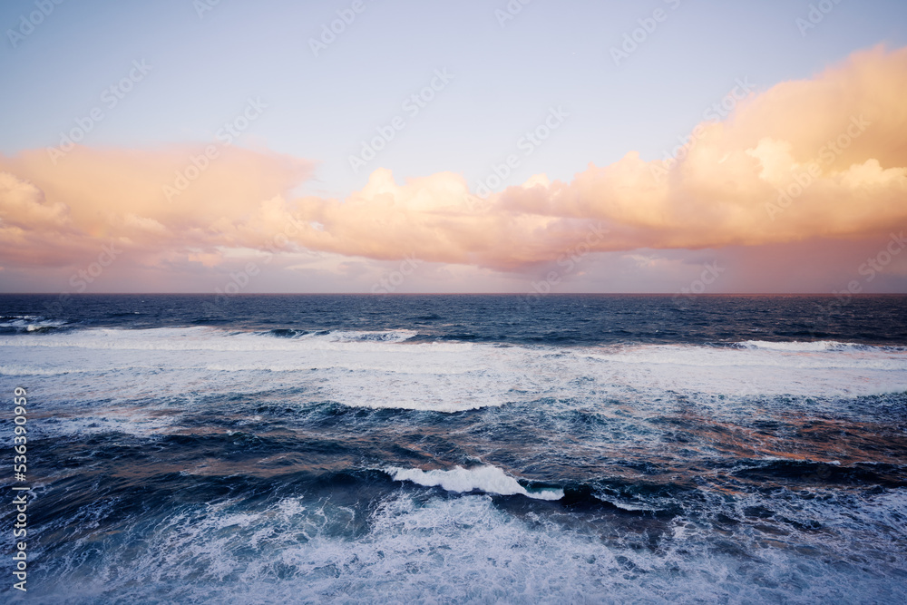 Amazing sunrise on Atlantic ocean. Waves and foam.