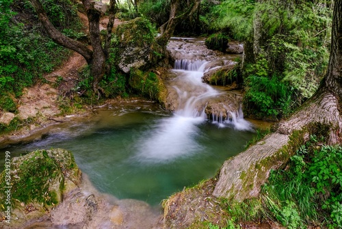 Closeup shot of Gostilje waterfall in the forest in Serbia photo