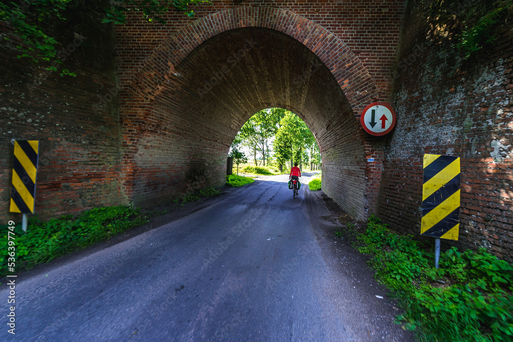 Road under railroad bridge in Gryfino County, Poland