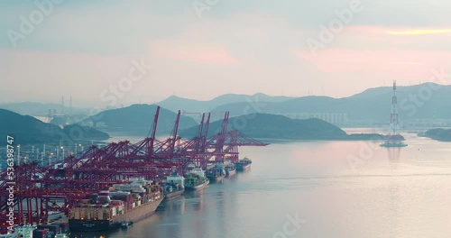 aerial view of commercial dock by river in ningbo at twilight photo